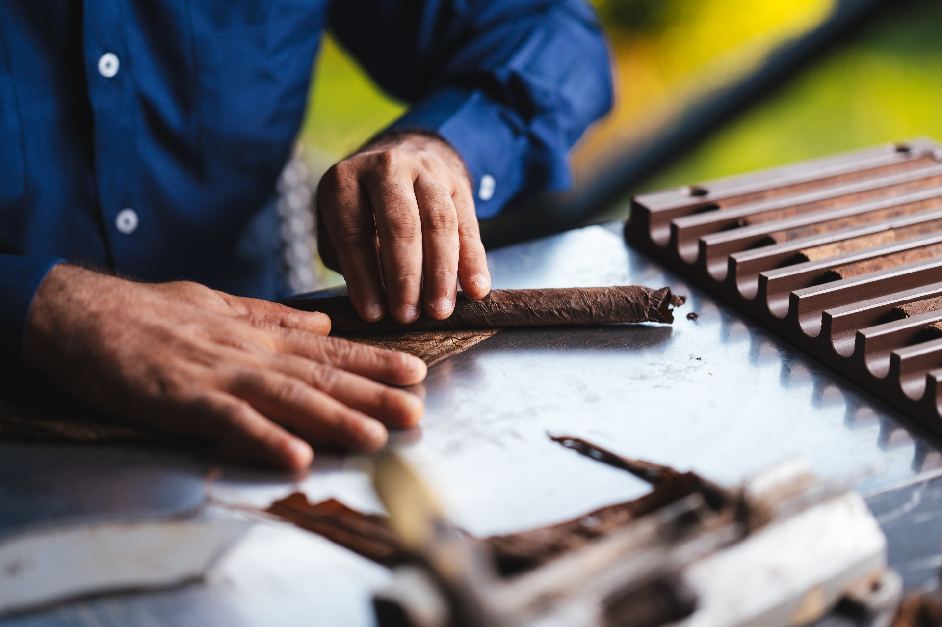 Master roller shaping a TíoLeo cigar by hand